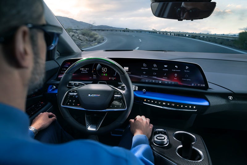 Front View of the 2026 OPTIQ-V Driving Through the Dusk Utilizing its Headlights | Rothbard Chevrolet in GRAPEVINE TX